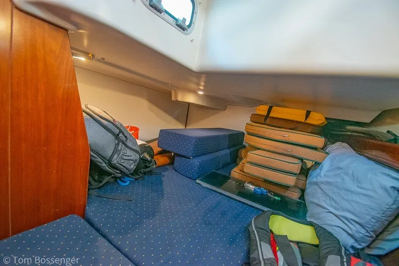 Slide: The Image of Cozy cabin interior of 2005 Beneteau Oceanis 423 sailboat with cushions and gear. - 33