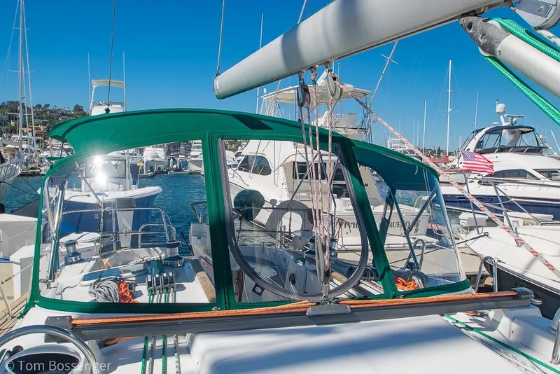 Slide: The Image of Beneteau Oceanis 423 sailboat, 2005 model, docked in a marina with green canopy. - 59