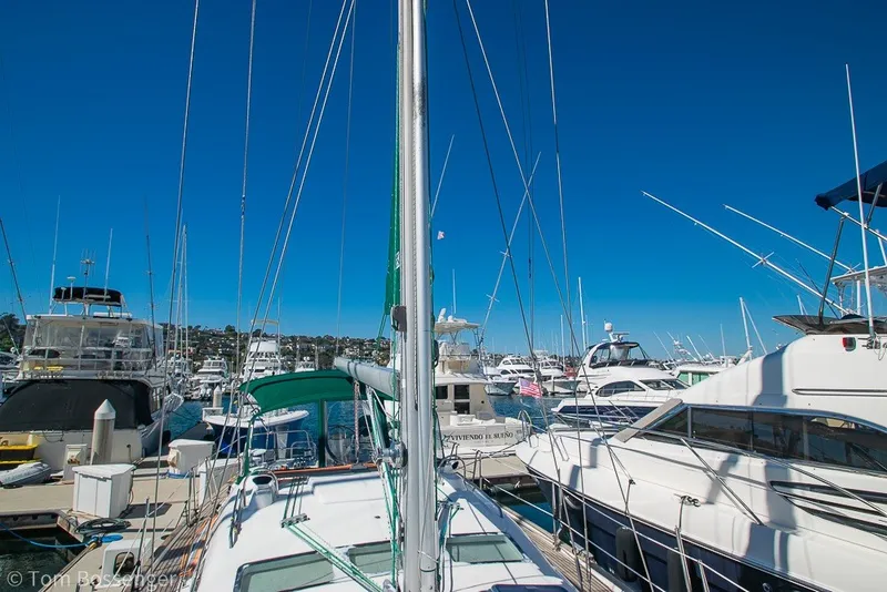 Slide: The Image of Marina with 2005 Beneteau Oceanis 423 sailboat among other yachts under clear blue sky. - 62