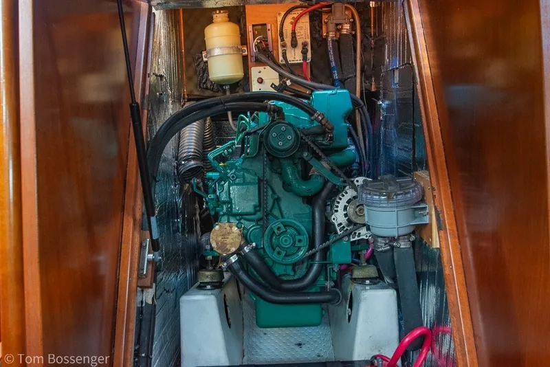 Slide: The Image of Engine compartment of a 2005 Beneteau Oceanis 423 sailboat, showcasing detailed mechanical components. - 70