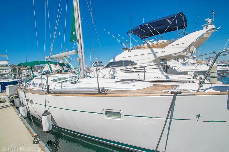 Slide: The Image of 2005 Beneteau Oceanis 423 sailboat docked at marina under clear blue sky. - 4