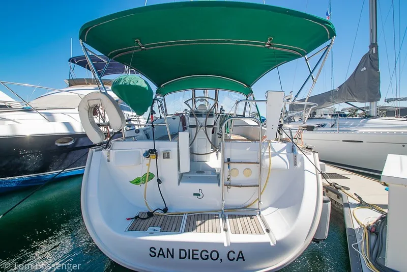 Slide: The Image of 2005 Beneteau Oceanis 423 sailboat docked in San Diego marina with green canopy. - 6