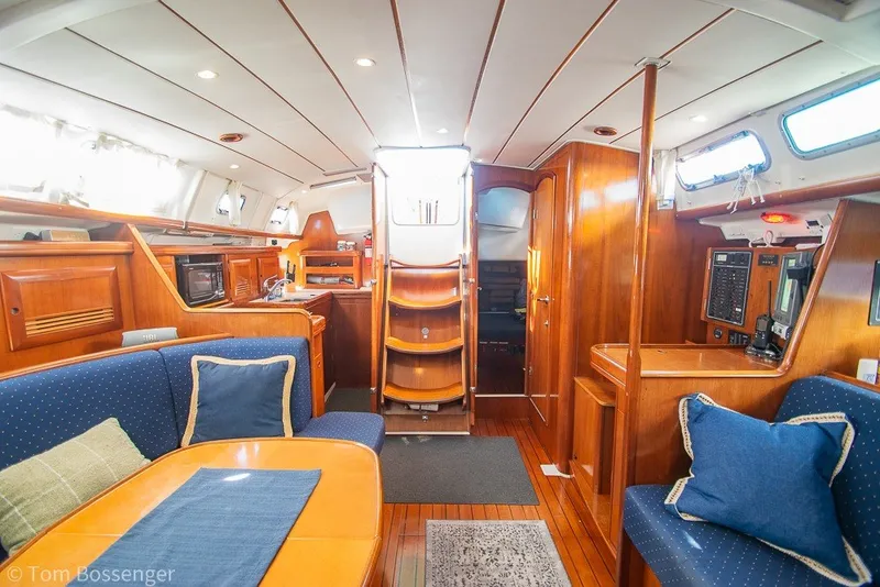 Slide: The Image of Interior of 2005 Beneteau Oceanis 423 yacht with wooden furnishings and cozy seating. - 25