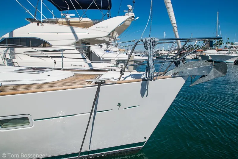 Slide: The Image of Beneteau Oceanis 423 sailboat, 2005 model, docked in a marina under clear blue skies. - 5