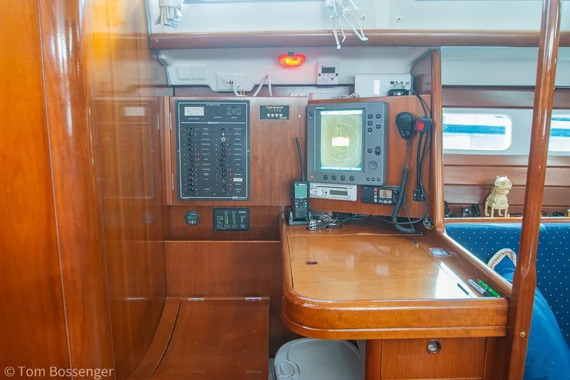 Slide: The Image of Navigation station on a 2005 Beneteau Oceanis 423 sailboat with control panel and equipment. - 18