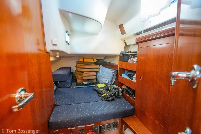 Slide: The Image of Cozy cabin interior of 2005 Beneteau Oceanis 423 sailboat with wooden furnishings and storage. - 32