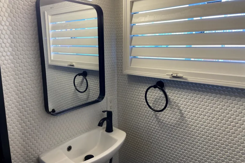 Slide: The Image of Bathroom interior of 1978 Thompson motor yacht with modern sink and mirror. - 10