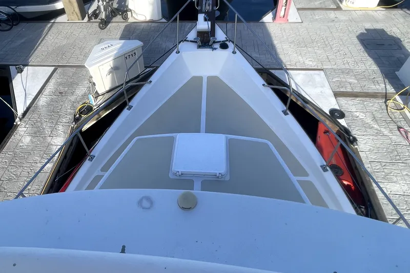 Slide: The Image of 1978 Thompson motor yacht deck view at marina, showcasing sleek design and railing. - 7