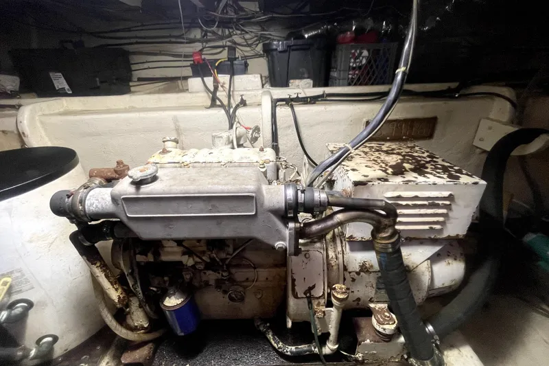 Slide: The Image of Engine room of a 1978 Thompson motor yacht, showcasing vintage machinery and wiring. - 29