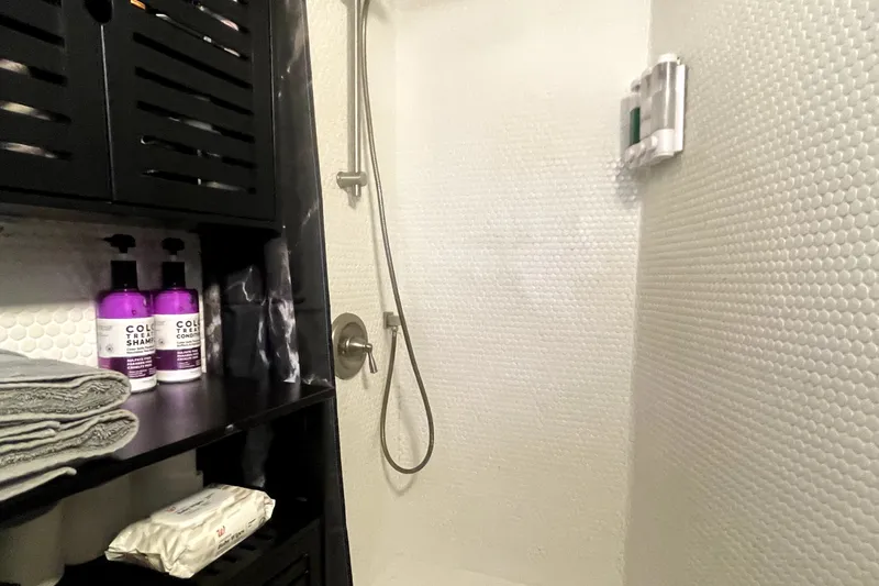 Slide: The Image of Shower area in a 1978 Thompson motor yacht with toiletries and towels. - 9