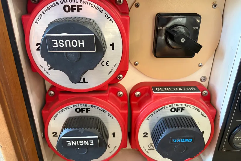 Slide: The Image of Control panel with switches on a 2000 Albin 35 Tournament Express boat. - 19