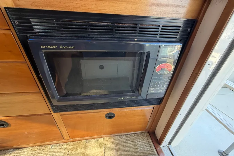 Slide: The Image of Sharp Carousel microwave in 2000 Albin 35 Tournament Express boat interior. - 29