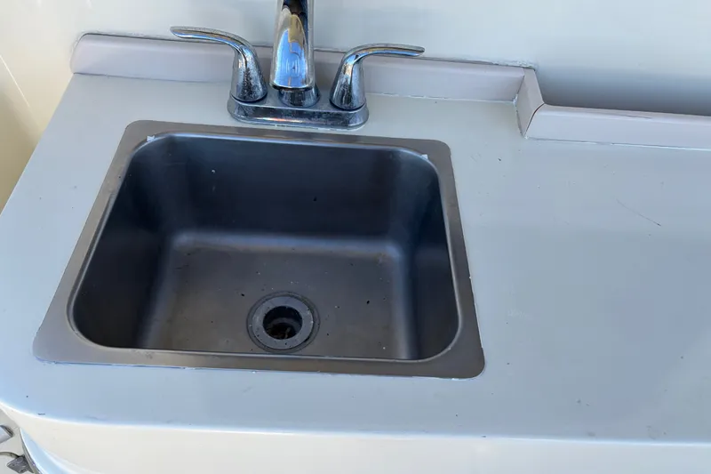 Slide: The Image of Stainless steel sink with faucet on 2000 Albin 35 Tournament Express boat. - 67