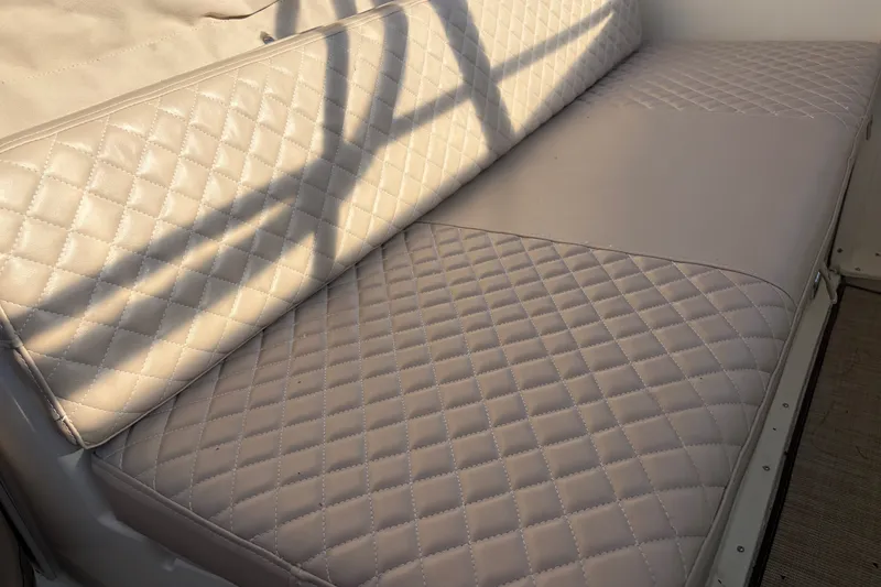 Slide: The Image of Quilted beige seating on 2000 Albin 35 Tournament Express boat interior. - 66
