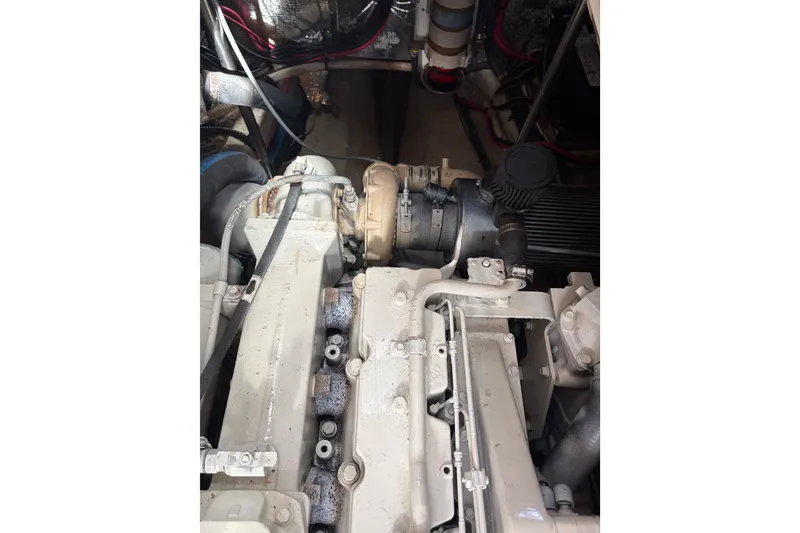 Slide: The Image of Engine compartment of a 2000 Albin 35 Tournament Express boat, showcasing mechanical components. - 44