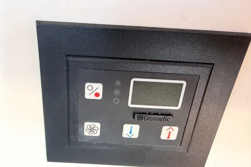 Slide: The Image of Dometic control panel on a 2000 Albin 35 Tournament Express boat. - 35