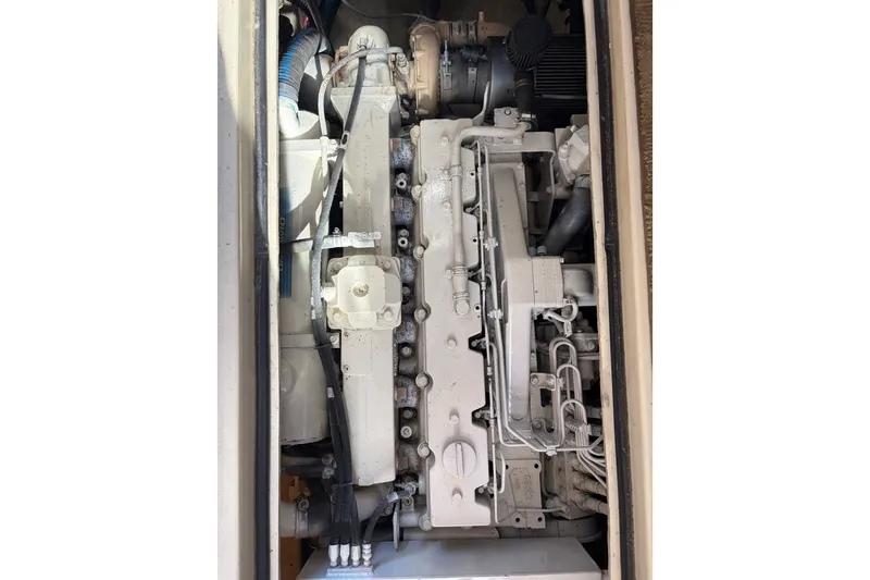 Slide: The Image of Engine compartment of a 2000 Albin 35 Tournament Express boat, showcasing mechanical components. - 42