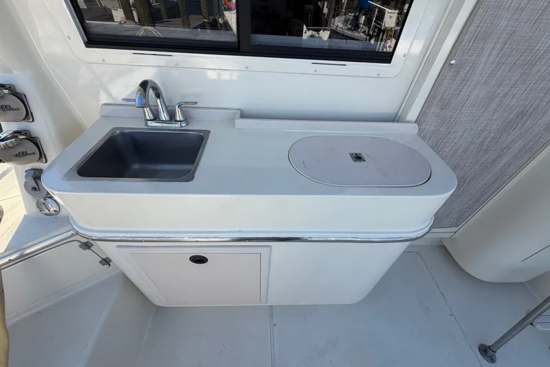 Slide: The Image of Compact kitchenette on 2000 Albin 35 Tournament Express boat with sink and storage. - 68