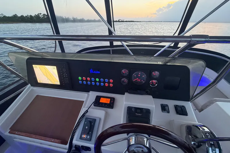 Slide: The Image of Helm of 2000 Albin 35 Tournament Express boat with navigation equipment at sunset. - 47