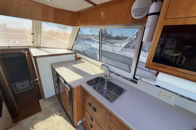 Slide: The Image of Interior of 2000 Albin 35 Tournament Express with kitchenette and windows. - 26