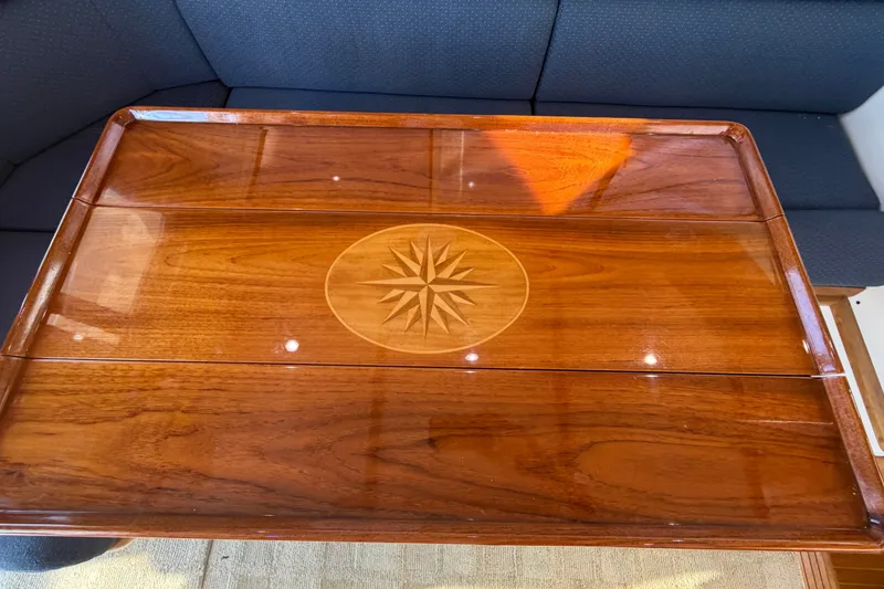 Slide: The Image of Polished wooden table with compass rose design on Albin 35 Tournament Express, 2000 model. - 40