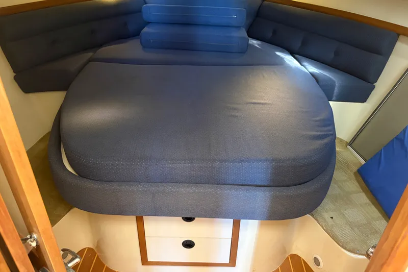 Slide: The Image of Cozy cabin interior of 2000 Albin 35 Tournament Express with blue bedding. - 20