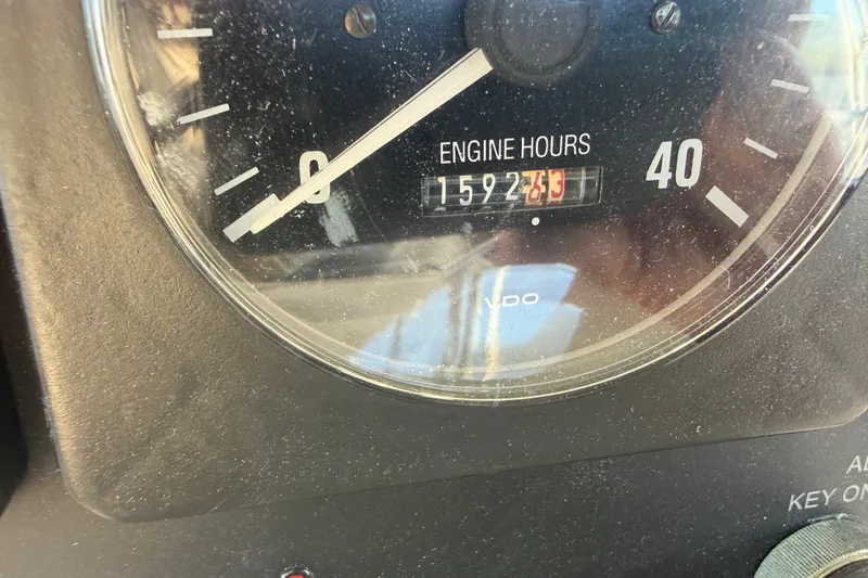 Slide: The Image of Close-up of Albin 35 Tournament Express 2000 engine hour meter showing 1592.7 hours. - 51