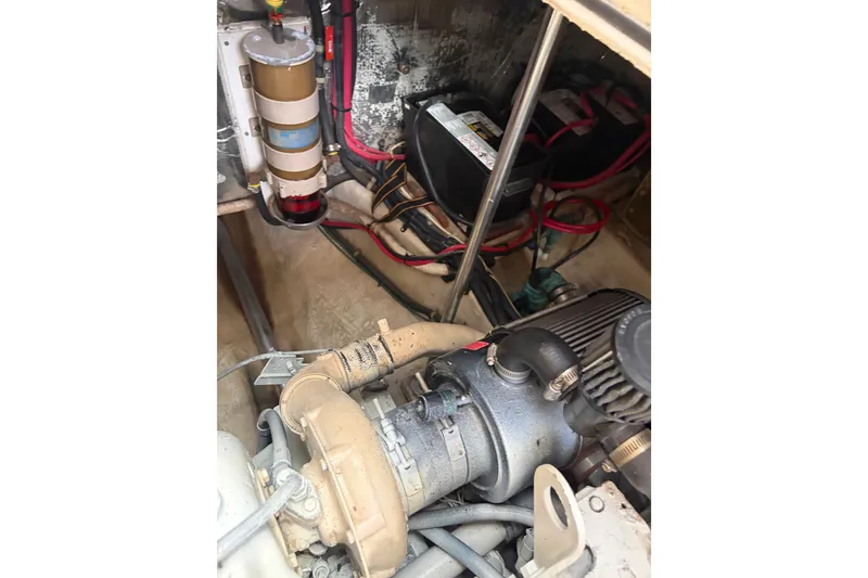 Slide: The Image of Engine compartment of a 2000 Albin 35 Tournament Express boat, showing components and wiring. - 45