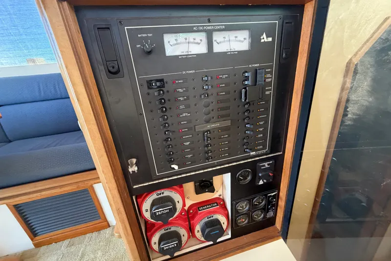 Slide: The Image of Electrical panel of a 2000 Albin 35 Tournament Express boat, featuring AC/DC controls. - 15