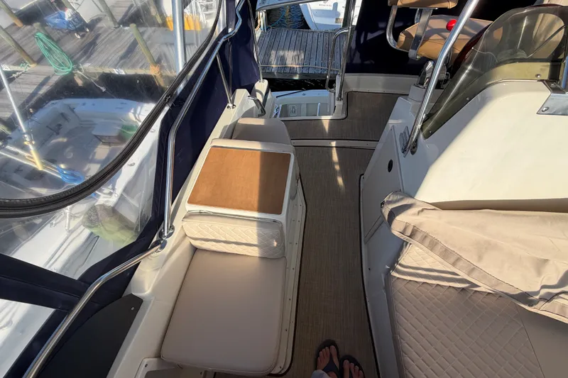 Slide: The Image of Interior view of a 2000 Albin 35 Tournament Express boat with seating and helm area. - 64