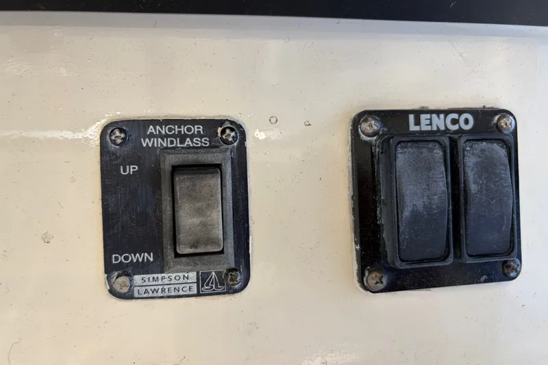 Slide: The Image of Control panel on a 2000 Albin 35 Tournament Express boat, featuring anchor windlass and Lenco switches. - 55