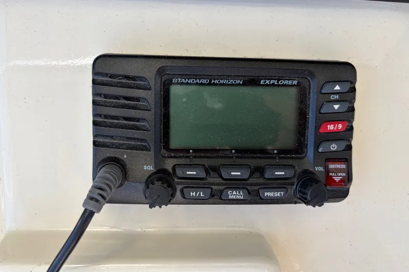 Slide: The Image of Standard Horizon Explorer radio on 2000 Albin 35 Tournament Express boat dashboard. - 53