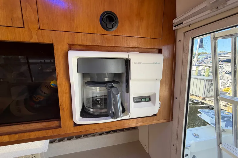 Slide: The Image of Built-in coffee maker on 2000 Albin 35 Tournament Express boat interior. - 31