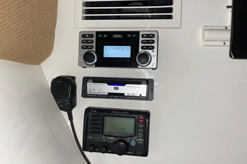 Slide: The Image of Control panel of a 2008 Intrepid 370 Cuddy with radio and communication equipment. - 15