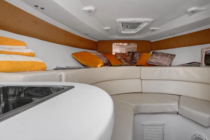Slide: The Image of Interior of 2008 Intrepid 370 Cuddy with cozy seating and colorful cushions. - 21