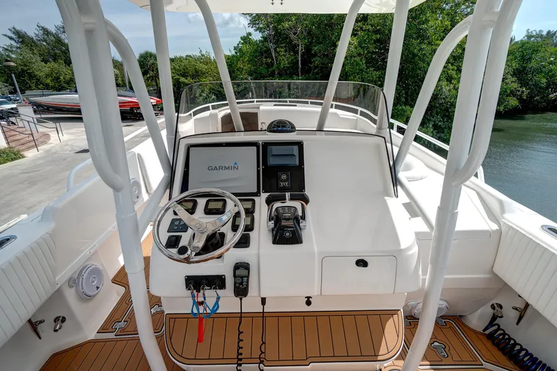 Slide: The Image of 2008 Intrepid 370 Cuddy boat helm with Garmin navigation system and modern controls. - 28