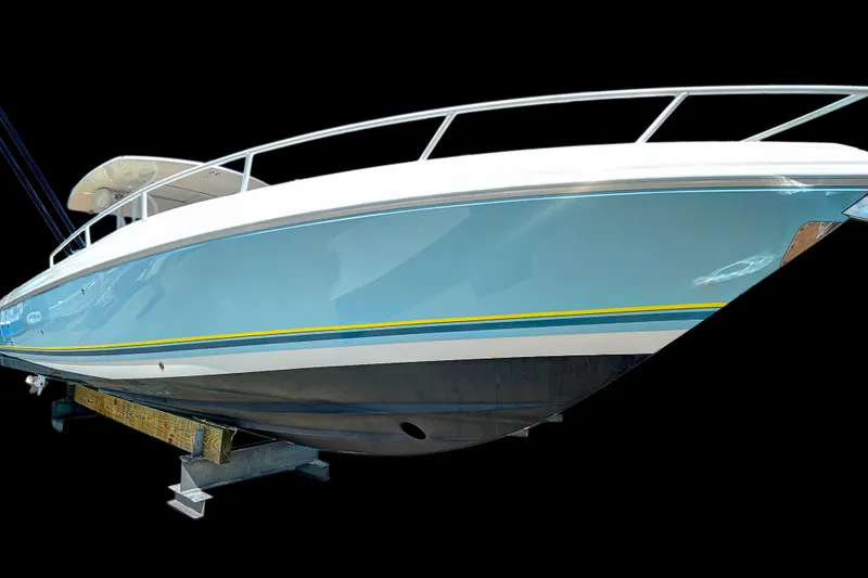 Slide: The Image of 2008 Intrepid 370 Cuddy boat with sleek blue hull on display. - 9