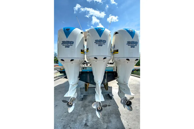 Slide: The Image of Triple Yamaha 350 V8 outboard engines on a 2008 Intrepid 370 Cuddy boat. - 29