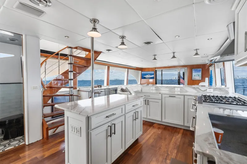 Slide: The Image of Luxurious 1998 Cheoy Lee Motor Yacht interior with modern kitchen and ocean view. - 19