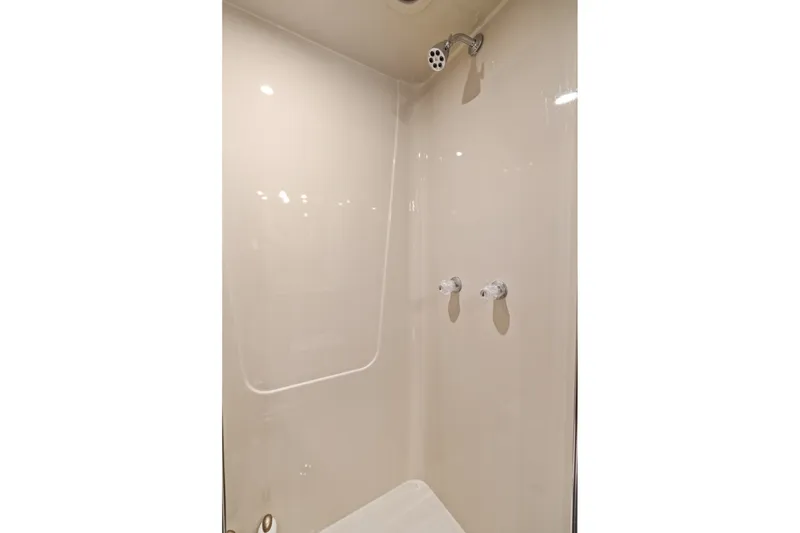 Slide: The Image of Shower area in 1998 Cheoy Lee Motor Yacht, featuring sleek fixtures and minimalist design. - 42