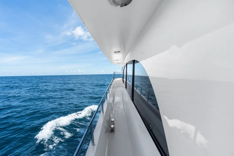 Slide: The Image of Side view of a 1998 Cheoy Lee Motor Yacht cruising on open sea. - 75