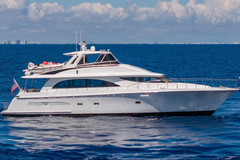 The Image of 1998 Cheoy Lee Motor Yacht cruising on open ocean under clear skies. - 0