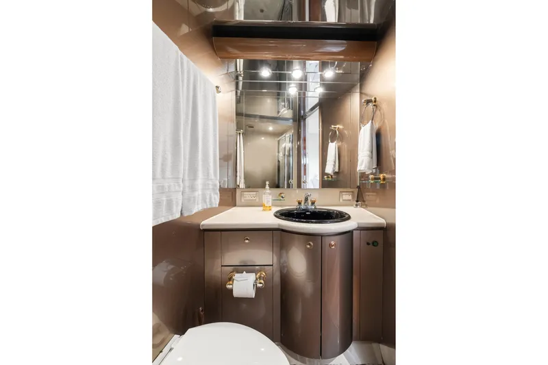 Slide: The Image of Luxurious bathroom on a 1998 Cheoy Lee Motor Yacht with elegant fixtures and mirrored accents. - 41