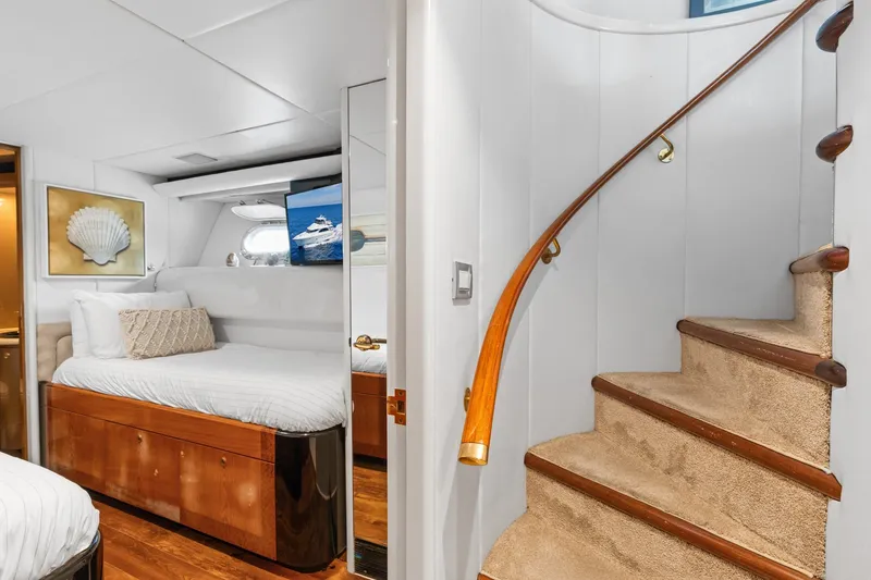 Slide: The Image of Luxurious 1998 Cheoy Lee Motor Yacht interior with elegant staircase and cozy bedroom. - 23