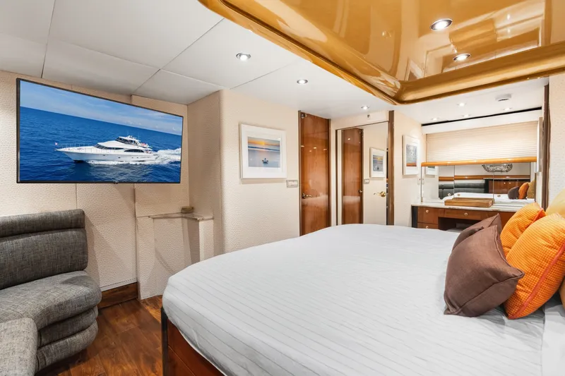 Slide: The Image of Luxurious 1998 Cheoy Lee Motor Yacht bedroom with modern decor and ocean view on TV. - 28