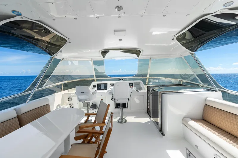 Slide: The Image of Luxurious 1998 Cheoy Lee Motor Yacht interior with ocean view and elegant seating. - 49