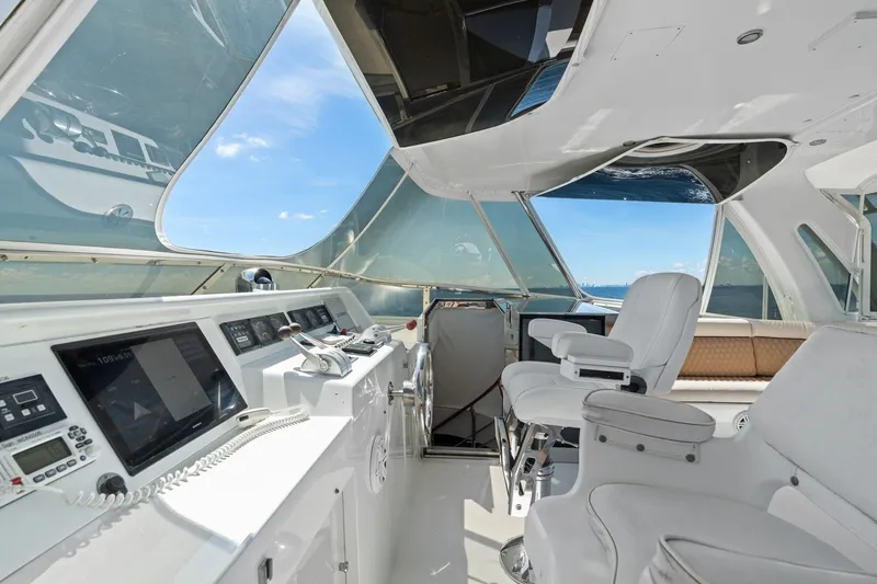 Slide: The Image of 1998 Cheoy Lee Motor Yacht helm with modern controls and panoramic windows. - 55