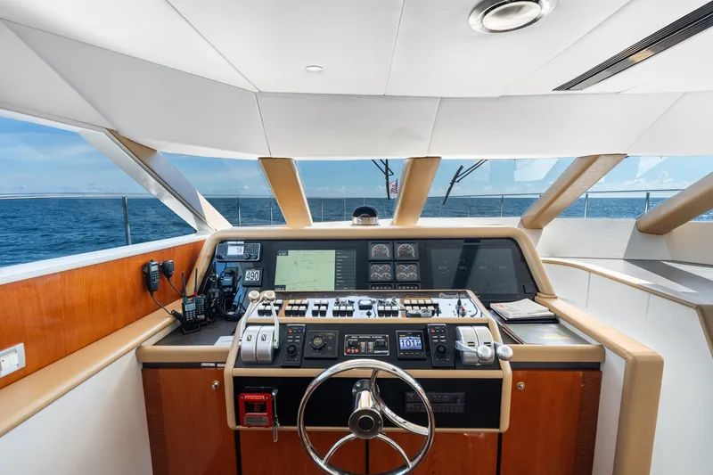 Slide: The Image of Cockpit of 1998 Cheoy Lee Motor Yacht with navigation controls and ocean view. - 65