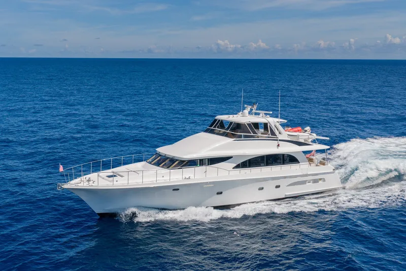 Slide: The Image of 1998 Cheoy Lee Motor Yacht cruising on open blue sea under clear skies. - 2