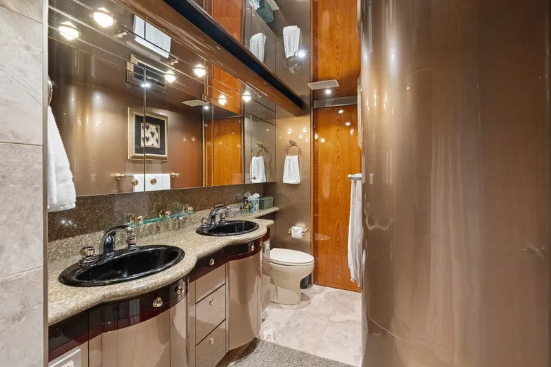 Slide: The Image of Luxurious bathroom interior of a 1998 Cheoy Lee Motor Yacht with dual sinks and elegant finishes. - 31